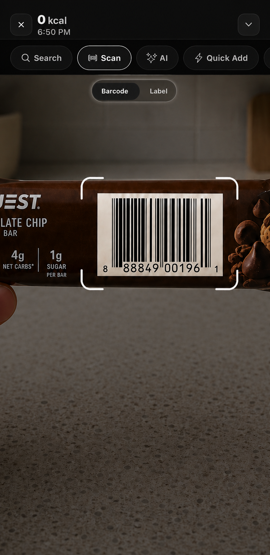 Nutoro barcode scanner aimed at a protein bar barcode